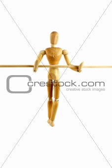 Manikin waling a tightrope