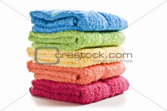 Colorful towels on a white background with space for text