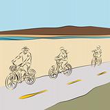 Family Riding Bicycles On The Beach