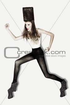 Fashion model with sculpted hair and high-heels in studio