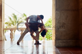 latin american man and woman dancing 
