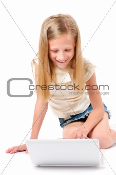 Little girl with laptop on white background