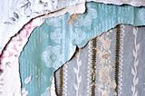 Layers of torn wallpaper