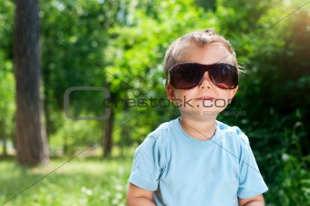Boy Sunglasses in the summer park
