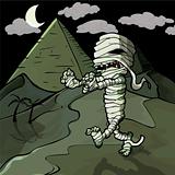 Scary cartoon Egyptian mummy in front of pyramids