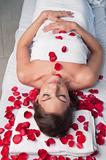 Beautiful relaxed woman lying on a massage table