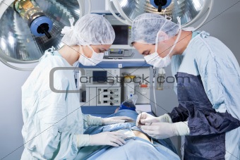 Medical professionals performing an operation