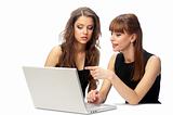 Two women working on a laptop