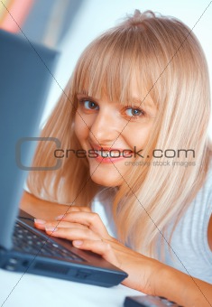 Close-up of a woman with laptop