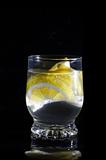 water with lemon in glass