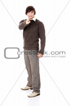 Full portrait of handsome happy young man pointing.
