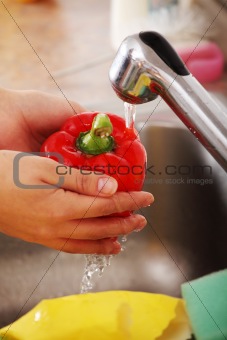 Woman washing vegetable