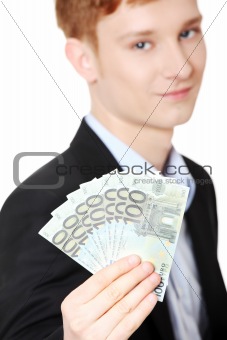 Young handsome businessman holding euros
