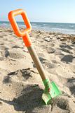 Beach shovel on sand