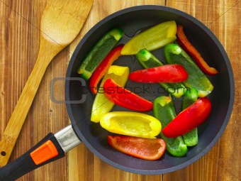 sliced bell peppers in frying pan