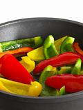 sliced bell peppers in frying pan