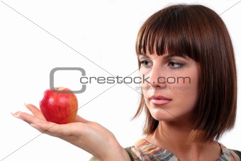 Young woman looks at an applee