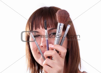 Young woman with make-up accessories