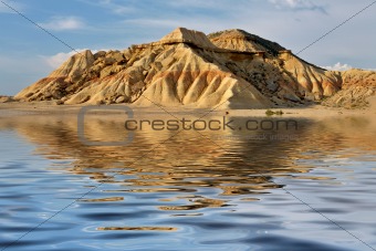 Hill reflected in the water