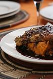 Grilled chicken breast, red wine sauce; close crop tall