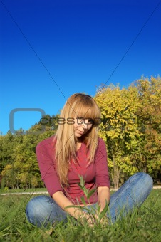 blond relaxing on the grass