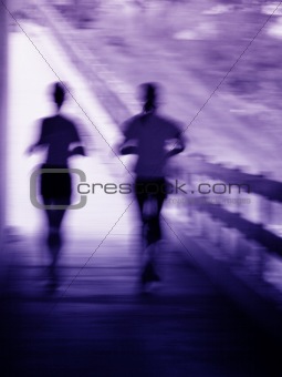 Artistic blur of a running couple
