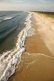 Waves crashing on beach.