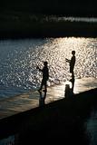 Boys fishing on dock.