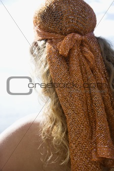 Woman in head scarf.