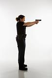 Policewoman aiming gun.