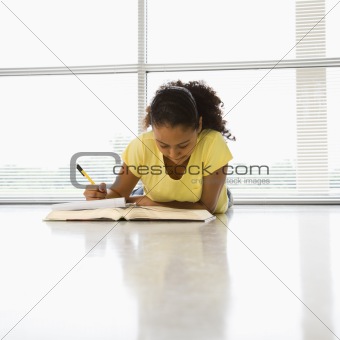 Girl doing schoolwork.