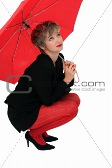 Businesswoman with a red umbrella