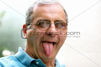 Mature man with his tongue out