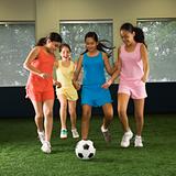 Girls playing soccer.
