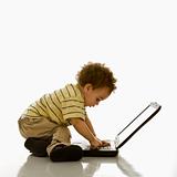 Baby using laptop.
