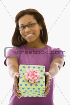 Woman presenting gift.