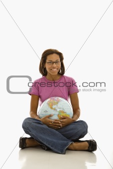 Woman holding globe.