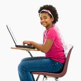 Schoolgirl on laptop.