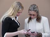 Blond women with phones
