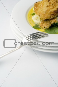 Chicken schnitzel; portrait mid with fork