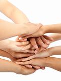 group of young people's hands together