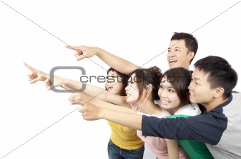 happy Asian young group pointing away isolated on white background