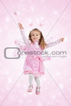 Little girl in fairy costume jump