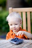 toddler eating berries