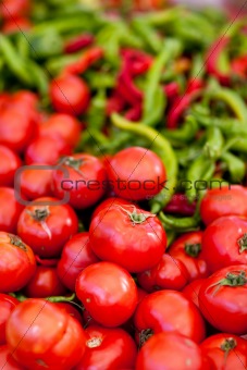 pile of fresh tomatoes and peppers