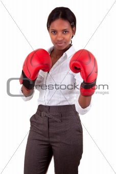 Young black woman wearing boxing gloves