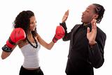 Young black woman and men boxing 