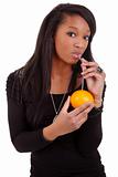 young black woman drinking orange juice 