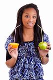 Young black girl holding fruits