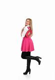 pretty shopping woman in pink dress standing. studio shot